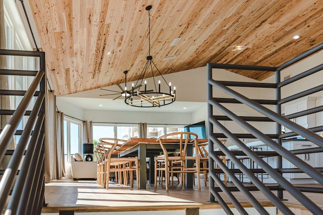 stairway with wooden ceiling, high vaulted ceiling, and an inviting chandelier