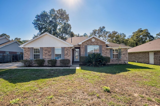 single story home featuring a front yard