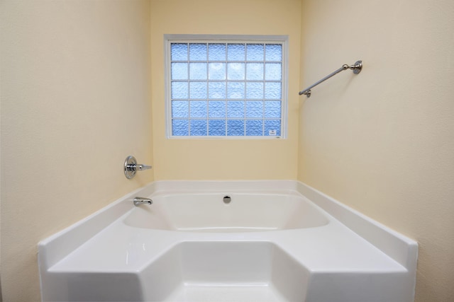 bathroom with a washtub