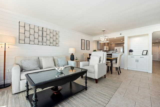 living room featuring light tile patterned flooring and crown molding