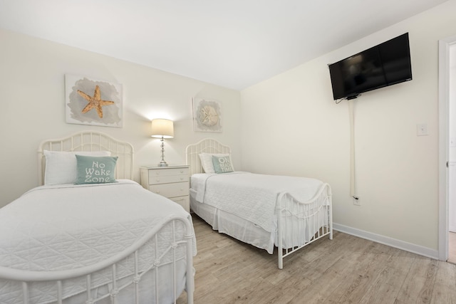 bedroom with light hardwood / wood-style floors