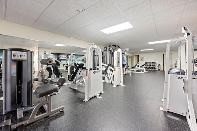 exercise room with a drop ceiling