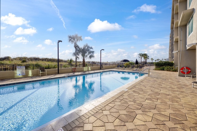 view of swimming pool featuring a patio area