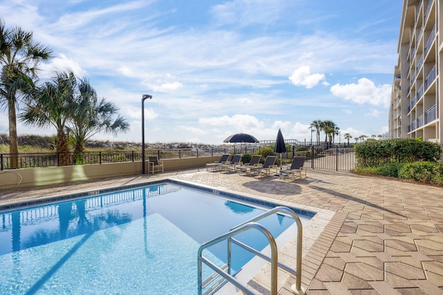 view of pool featuring a patio