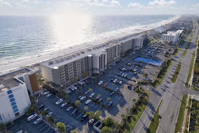 bird's eye view featuring a water view and a view of the beach