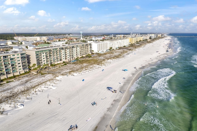 drone / aerial view with a water view and a view of the beach