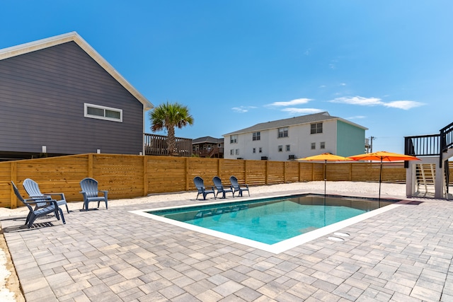 view of swimming pool featuring a patio