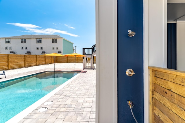 view of swimming pool featuring a patio