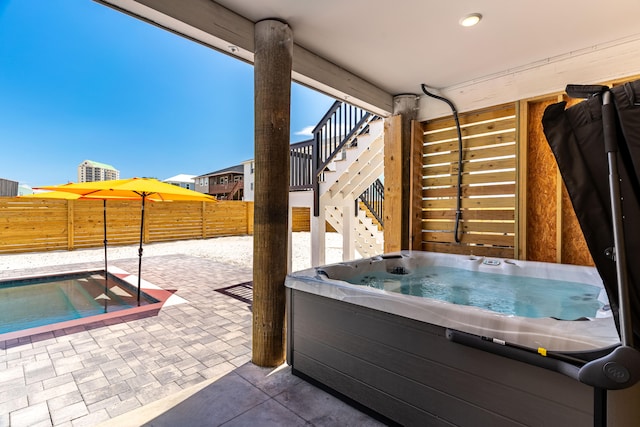 view of patio featuring a hot tub