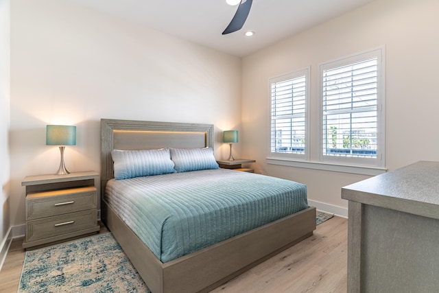 bedroom featuring light hardwood / wood-style flooring and ceiling fan