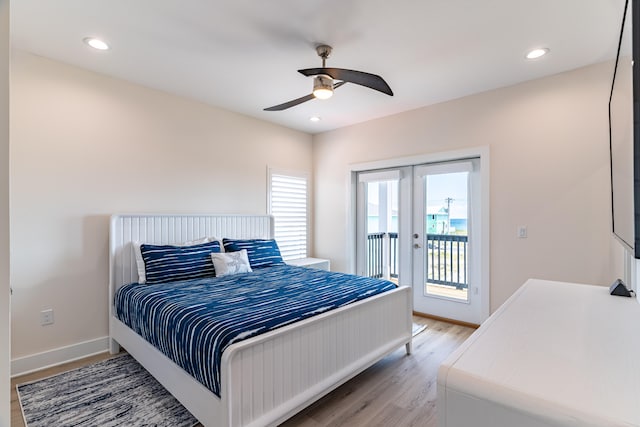 bedroom with hardwood / wood-style floors, ceiling fan, access to exterior, and french doors