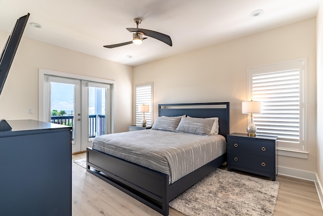 bedroom with ceiling fan, french doors, access to outside, and light hardwood / wood-style flooring