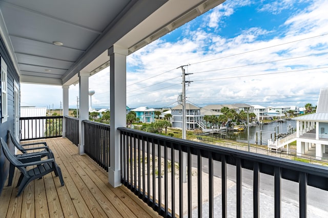 wooden terrace with a water view