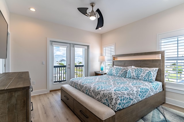 bedroom with multiple windows, ceiling fan, and light hardwood / wood-style flooring