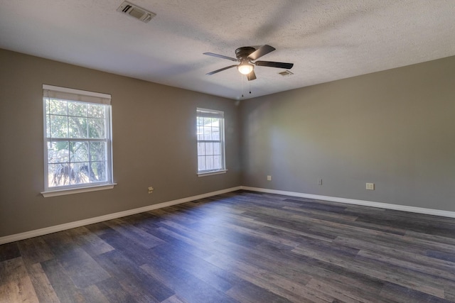 unfurnished room featuring a textured ceiling, ceiling fan, and dark hardwood / wood-style floors