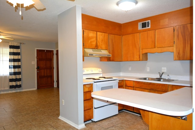 kitchen with ceiling fan, sink, white electric range oven, kitchen peninsula, and a textured ceiling