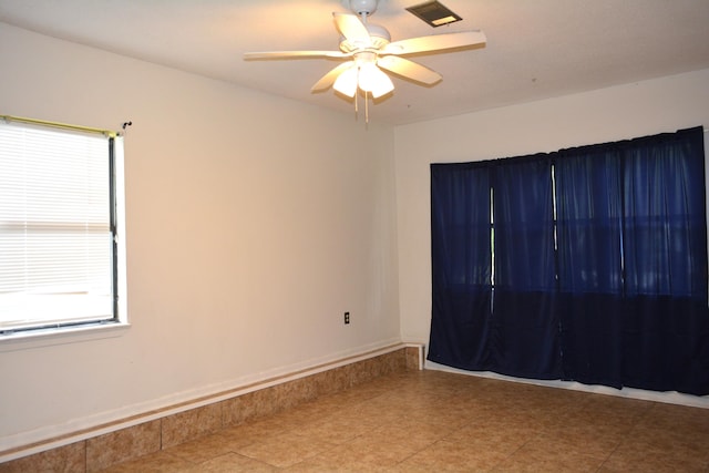 unfurnished room featuring ceiling fan