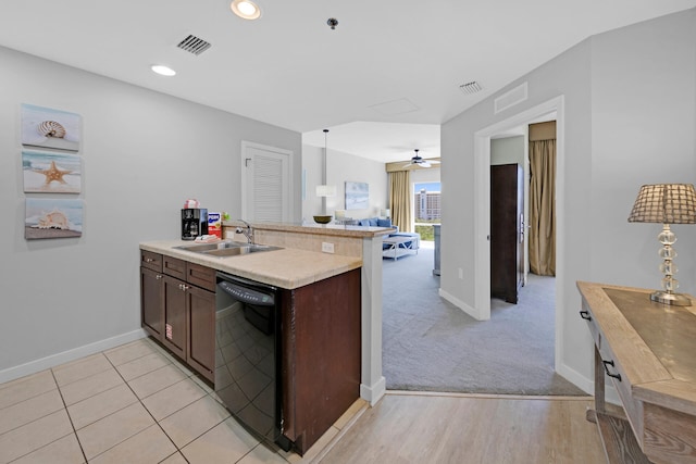 kitchen featuring dishwasher, light carpet, sink, ceiling fan, and kitchen peninsula