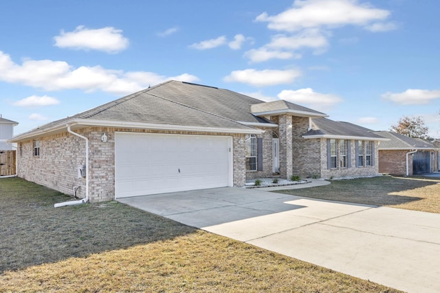 ranch-style house with a garage and a front yard