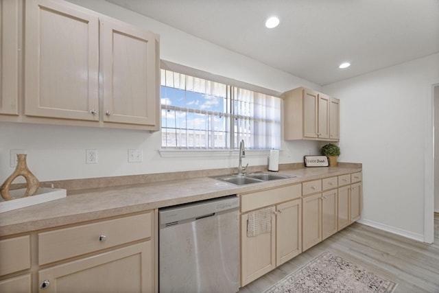 kitchen with dishwasher, light wood-type flooring, and sink