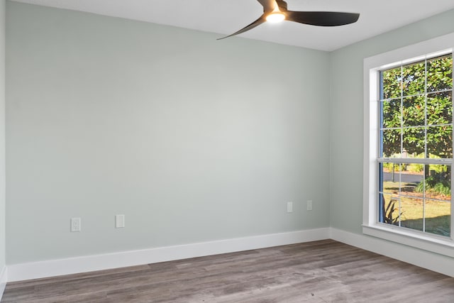 unfurnished room featuring hardwood / wood-style flooring and ceiling fan