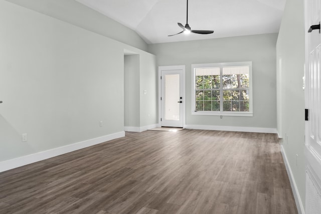 unfurnished living room featuring ceiling fan, dark wood-type flooring, and vaulted ceiling