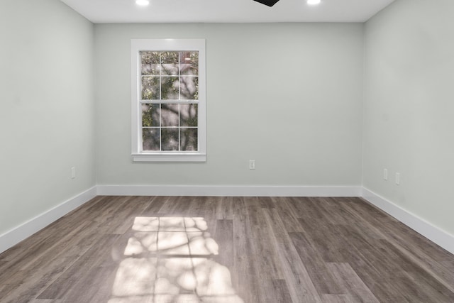 spare room featuring ceiling fan and wood-type flooring