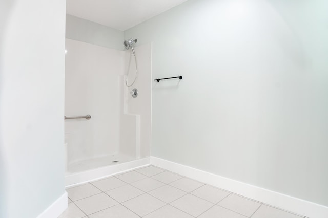 bathroom featuring tile patterned flooring and walk in shower