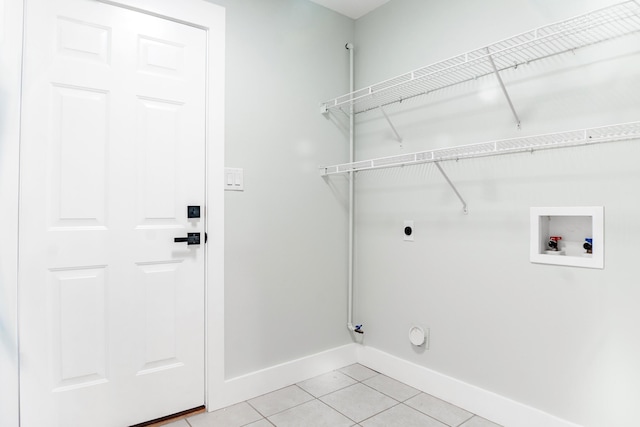 59 Marigot Bay Cir, Miramar Beach, FL 32550 - laundry room featuring baseboards, hookup for an electric dryer, light tile patterned flooring, washer hookup, and gas dryer hookup