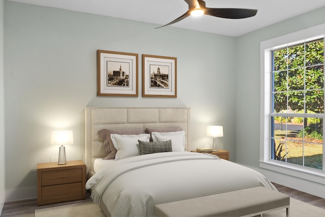 bedroom with ceiling fan and light hardwood / wood-style floors