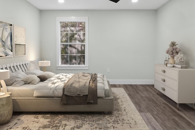 bedroom featuring dark hardwood / wood-style flooring and ceiling fan