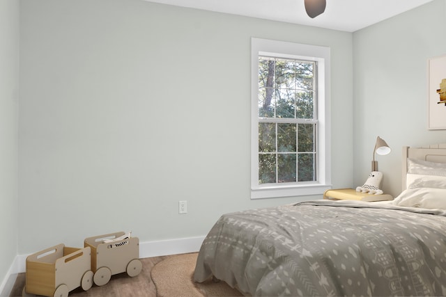 bedroom featuring ceiling fan and wood-type flooring