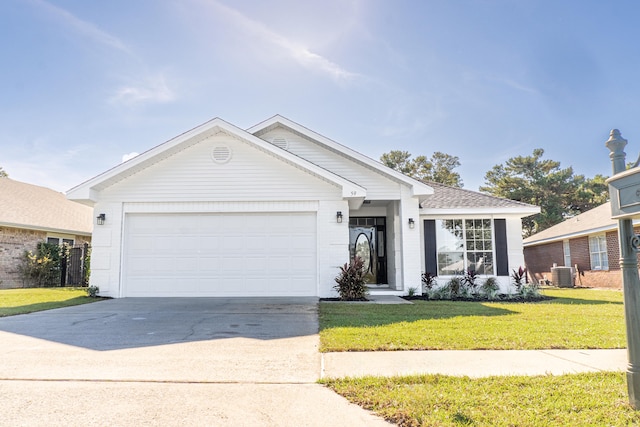 ranch-style home featuring a garage, central AC, and a front lawn