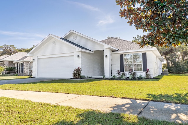 59 Marigot Bay Cir, Miramar Beach, FL 32550 - ranch-style home with an attached garage, a front yard, driveway, central AC, and roof with shingles