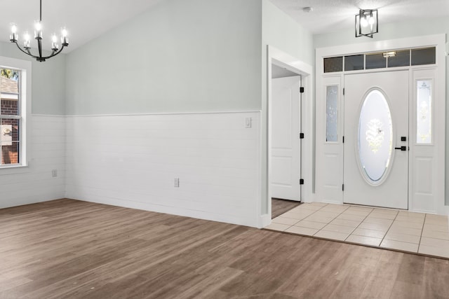 59 Marigot Bay Cir, Miramar Beach, FL 32550 - entrance foyer with a chandelier, wood finished floors, and wainscoting