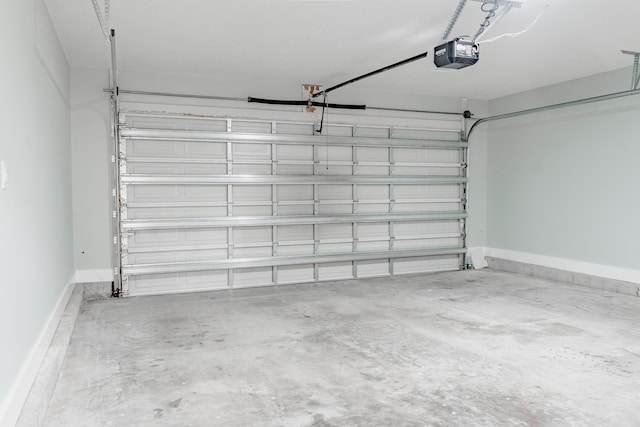 59 Marigot Bay Cir, Miramar Beach, FL 32550 - garage featuring a garage door opener and baseboards