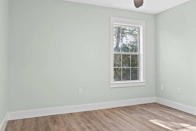 spare room with ceiling fan and light hardwood / wood-style floors