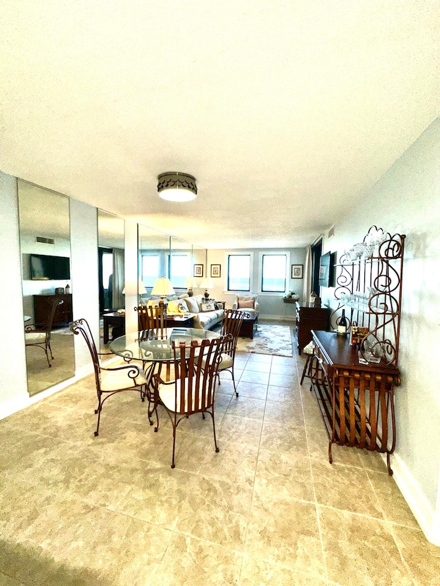 dining area with a textured ceiling