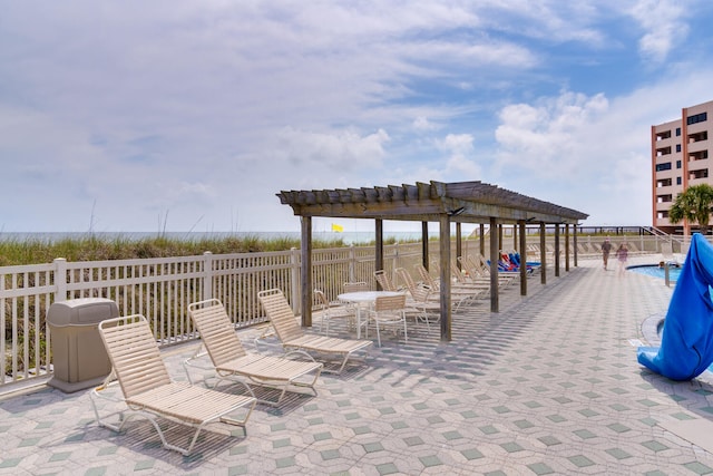 view of patio featuring a pergola and a community pool