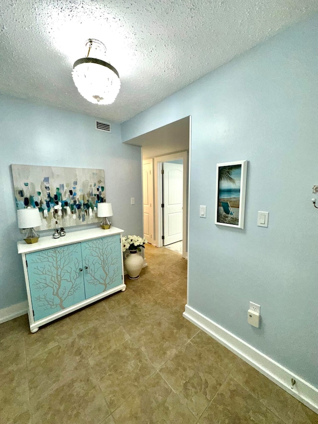 interior space featuring a textured ceiling