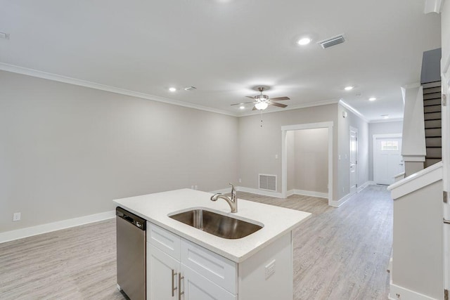 kitchen with white cabinetry, dishwasher, sink, an island with sink, and light hardwood / wood-style floors