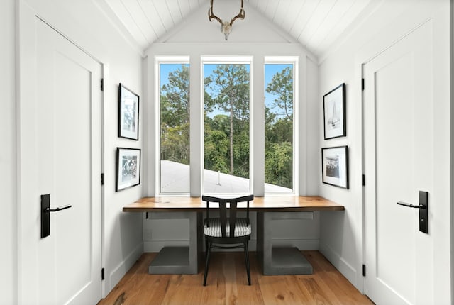 office with light hardwood / wood-style flooring, breakfast area, and vaulted ceiling