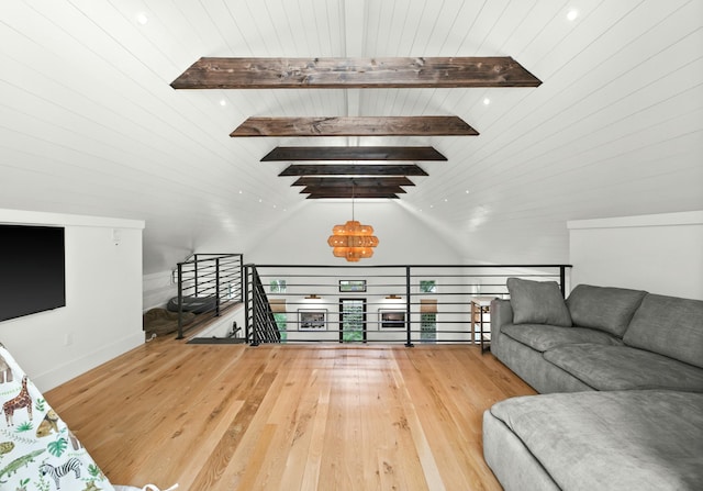 living room featuring wood ceiling, lofted ceiling with beams, and hardwood / wood-style flooring