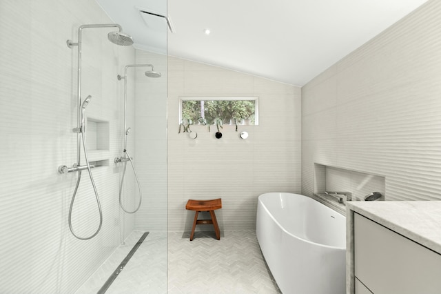 bathroom with vanity, plus walk in shower, and vaulted ceiling