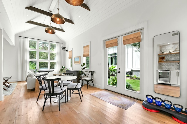 sunroom featuring wood ceiling, french doors, and lofted ceiling with beams