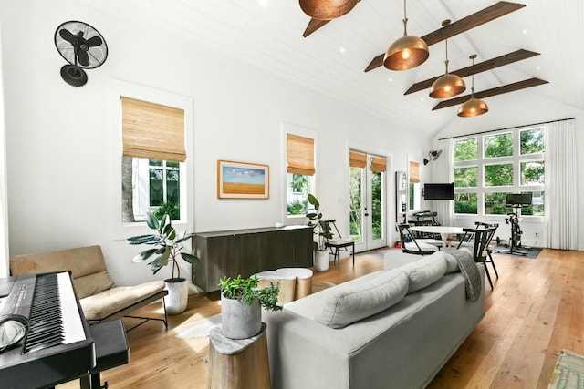 living room with beam ceiling, light hardwood / wood-style floors, high vaulted ceiling, and wooden ceiling