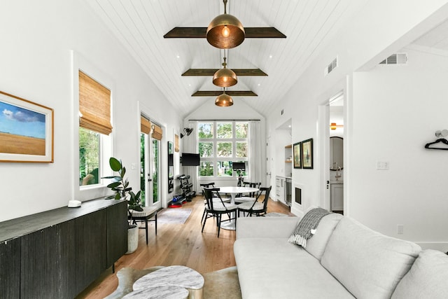 living room with wooden ceiling, high vaulted ceiling, and light hardwood / wood-style floors