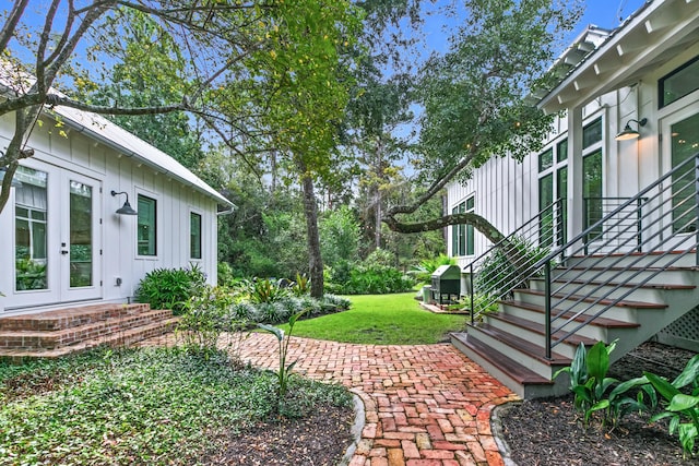 view of yard featuring french doors