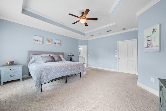 bedroom featuring ceiling fan, light colored carpet, ornamental molding, and a tray ceiling