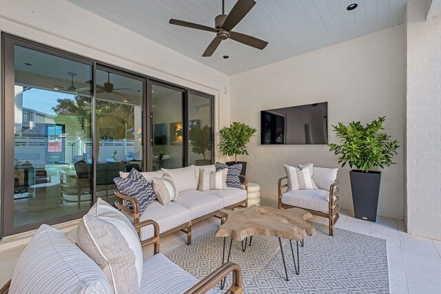 view of patio featuring ceiling fan and an outdoor living space